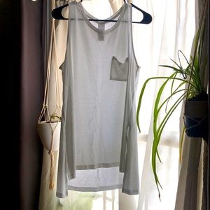 Large, white tank top with pocket.